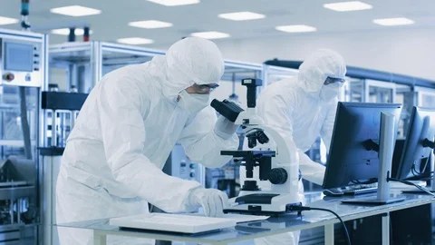 Research Scientists Work with Microscope and on Personal Computer in Laboratory. Stock Footage 93226293