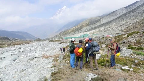 Research team standing in the rubble and discussing after the earthquake Stock Footage 77451256