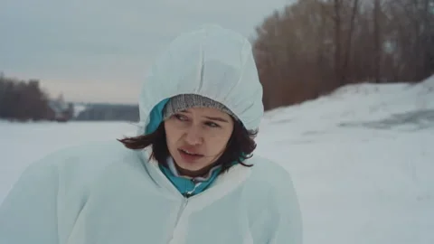 Research team in winter landscape. Scientists conduct surveys on icy shore Stock Footage 346470380