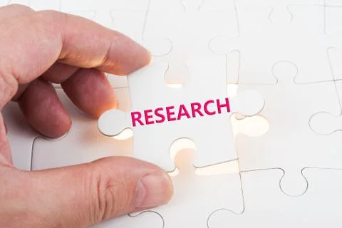 Research word on puzzle Stock Photos