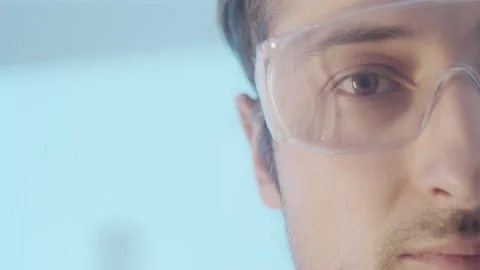 Research Work in a scientific laboratory. Close-up portrait. Part of the face of Stock Footage 171171728