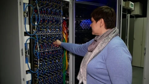 Researcher checks the performance of supercomputer with many wires. Stock Footage 167830683