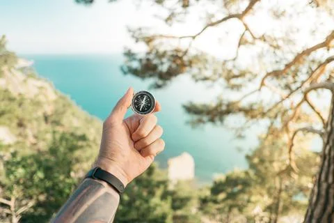 Researcher with a compass in hand Point Of View. Stock Photos