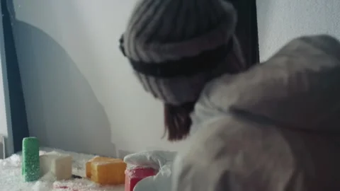 Researcher examines icy samples. Indoor scientist studying colorful cubes Stock Footage 346474572