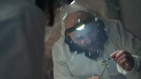 Researcher examines sample. Scientist in protective gear investigates object Video stock 342743178