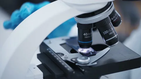 Researcher examines samples of a modern electron diode microscope close-up in a Stock-Footage 190079173