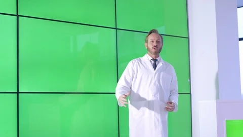Researcher explaining during presentation in front of green screen display Stock Footage 108188702