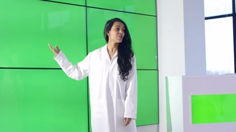 Researcher explaining during presentation in front of green screen display Stock Footage 108189810