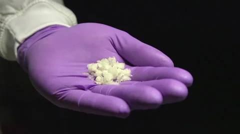 Researcher holds a sample Stock Footage 49965335