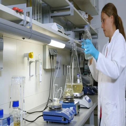 Researcher in the laboratory at the stirrer Video stock 69484446