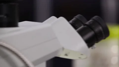 A Researcher looking at microscope Stock Footage 144826448