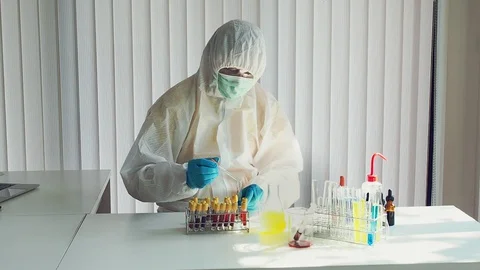 Researcher or scientists loads liquid sample into test tube in laboratory. Stock Footage 127844007