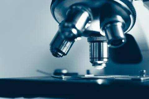 Researcher preparing sample for microscope analysis Stock Photos