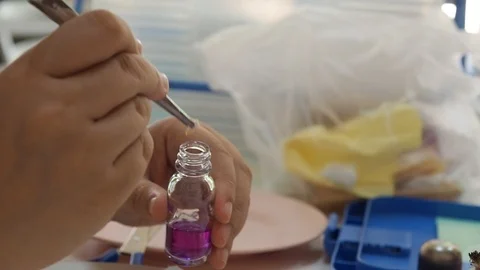 The researcher put a pieces of meat samples into a test bottle Stock Footage 88741901