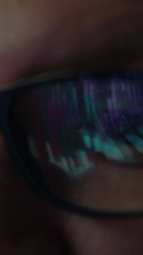 A researcher scrutinizes intricate data patterns displayed on their futurist Stock Footage 331529861