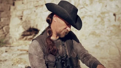 Researcher studies notes in a notebook in a medieval city Stock Footage 280357558