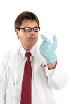 Researcher studying a microscope slide Stock Photos