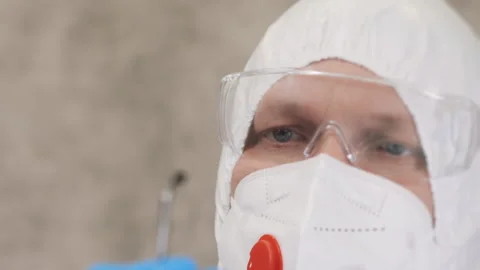 A researcher take a soil sample from a petri dish . Stock Footage 302172574