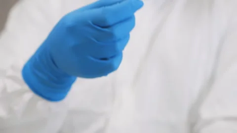 A researcher take a soil sample from a petri dish . 스톡 동영상 302172832