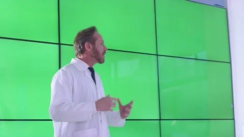 Researcher talking during presentation in front of green screen display Stock Footage 108187801