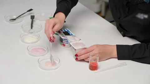 Researcher Testing Milk for Bacteria Stock Footage 305777547