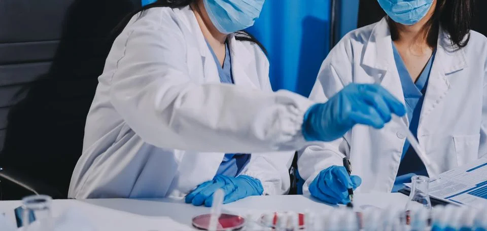 Researcher using a professional microscope 스톡 사진