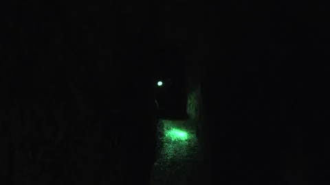 Researcher walks deep inside cave passage - Cave Wall and Underground Research Video stock 339817661