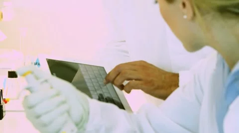 Researcher working and using tablet PC Stock Footage 8662736