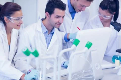 Researchers looking at computer screen in the lab Stock Photos