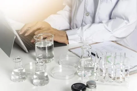 Researchers study data and conduct chemical experiments, in the creation of.. Stock Illustration