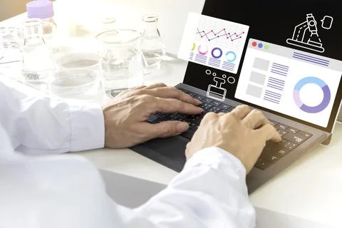 Researchers study data and conduct chemical experiments, in the creation of.. Stock Photos