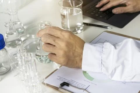 Researchers study data and conduct chemical experiments to create new chemi.. Stock Photos