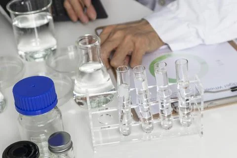 Researchers study data and experiment with chemicals, scientific process, r.. Stock Illustration