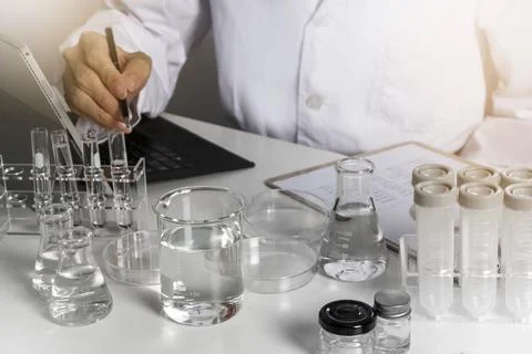 Researchers study data and experiment on chemicals, scientific process, dev.. Stock Photos