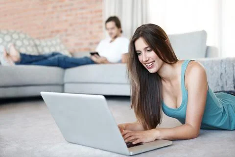 Researching for an important assignment. Attractive young woman surfing the net Foto stock