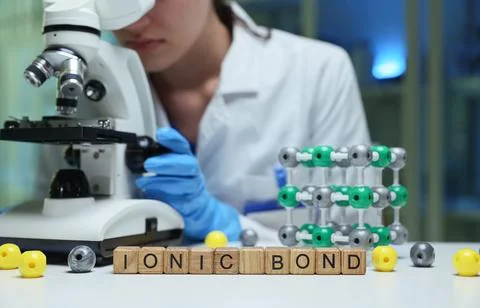 Researching Ionic Bonds with a Microscope in a WellEquipped Laboratory Stock Photos
