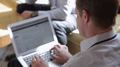 Researching on a laptop (1 of 2) Stock Footage 33828586
