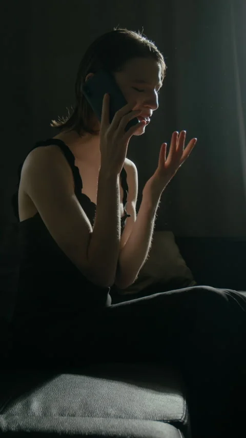 Resentful Girl Screaming into Phone Sorting Things out, Throwing It on Couch Vídeos de archivo 301193053