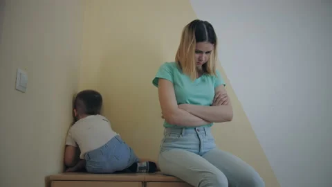 Resentment and quarrel between mom and little son, sit back to back, closes ears Stock Footage 187174955