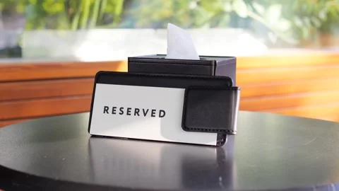 A reserved sign decorates a table in a restaurant Stock Footage 282717023