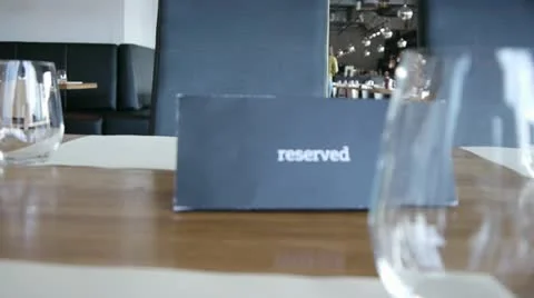 "Reserved" sign in restaurant table Stock Footage 12752393