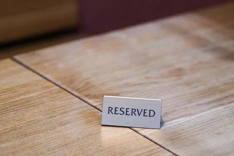 Reserved sign on a table Foto stock