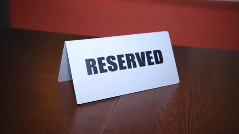 Reserved - a sign on the table in restaurant. Clouse up. Stock Footage 122390258