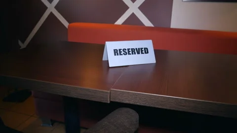 Reserved - a sign on the table in restaurant. Stock Footage 122390120