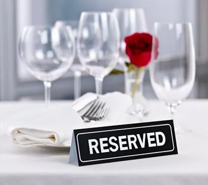 Reserved table at romantic restaurant Stock Photos