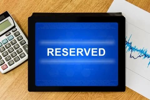 Reserved word on digital tablet Stock Photos