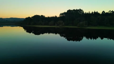 Reservoir With Mirror Reflections During Sunset. Wide Shot Stock Footage 258907436