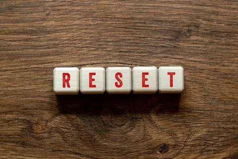 Reset - word concept on building blocks, text Stock Photos