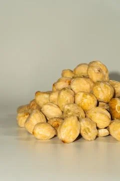 Resh whole candlenuts on neutral background Fotos de archivo