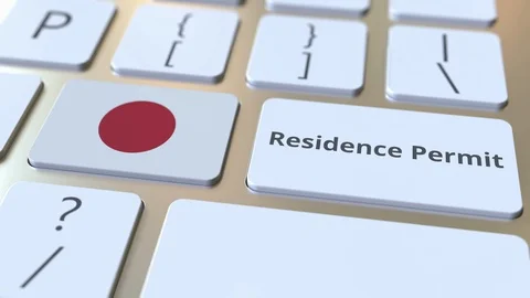 Residence Permit text and flag of Japan on the buttons on the computer keyboard Stock Footage 122992906
